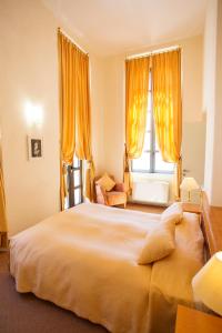 Postel nebo postele na pokoji v ubytování Miramare Apartments&Suites