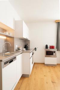 Kuchyňa alebo kuchynka v ubytovaní Apartments Hohenberger Mallnitz - Mein Platz in den Bergen!