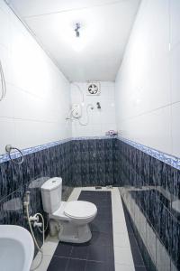 a bathroom with a toilet and a sink at 4ty two Homestay Galle in Galle +53 photos