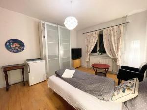 Postel nebo postele na pokoji v ubytování Christianshavns lakes room