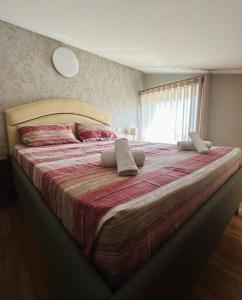 Postel nebo postele na pokoji v ubytování Casa Olivastri
