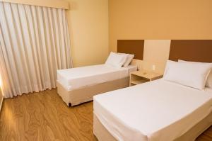 Postel nebo postele na pokoji v ubytování Thermas de Olimpia Resort