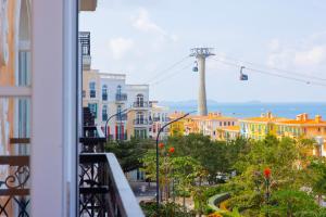 a balcony with a view of a city at Lotus Home Cafe - Cable Car Station in Phú Quốc