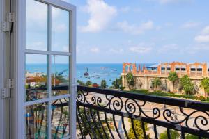 a view of the ocean from a balcony at Lotus Home Cafe - Cable Car Station in Phú Quốc