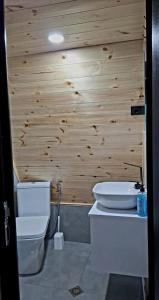 a bathroom with a toilet and a sink at Redi house in Batumi +29 photos