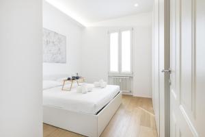 Ένα ή περισσότερα κρεβάτια σε δωμάτιο στο Eaylife - Milano - Corso Italia 68P4 - Navigli