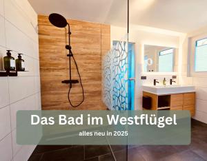 a bathroom with a shower with a glass backdoor at Lounge94 - Luxus auf 180 m2 in Wilhelmshaven +43 photos