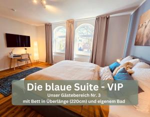a bedroom with a bed and a tv and a window at Lounge94 - Luxus auf 180 m2 in Wilhelmshaven