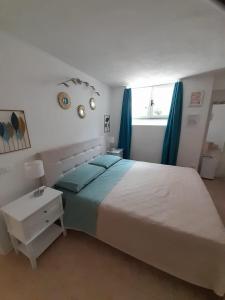 a bedroom with a large bed and a window at Appartamento Nora in Campese