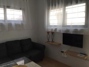 TV/trung tâm giải trí tại Cosy Flat Beachside