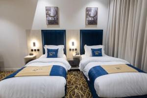 Postel nebo postele na pokoji v ubytování فندق تارا بلس Tara Plus Hotel