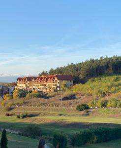 a large house on top of a hill at Ferzs Apartman Egerszalók in Egerszalók