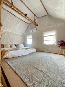 a bedroom with a bed in a tent at Bamboo Villas Huahin #1 in Hua Hin