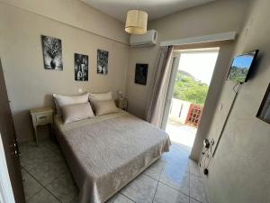 Posteľ alebo postele v izbe v ubytovaní Petasos House - Garden - Sea View