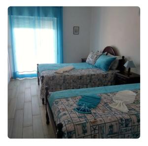 Katil atau katil-katil dalam bilik di Apartamento à Frente Do Mar com Vista