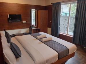 Ένα ή περισσότερα κρεβάτια σε δωμάτιο στο Misty Valley Inn