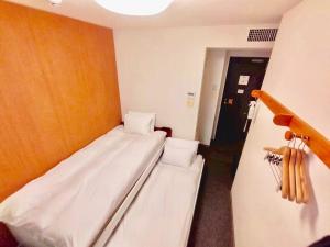 Postel nebo postele na pokoji v ubytování Web Hotel Tokyo Asakusabashi