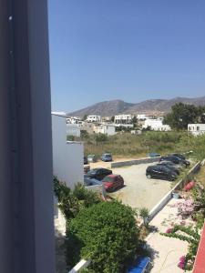 a view of a parking lot with cars parked at Fisilanis Beachfront Hotel in Logaras