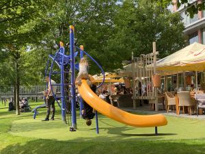 a child on a slide at a playground at Eurovea Tower Apartments in Petržalka