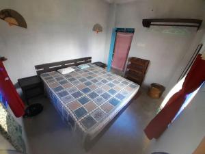 an aerial view of a bedroom with a bed and a door at Ganga river House in mayapur