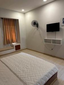 Ένα ή περισσότερα κρεβάτια σε δωμάτιο στο Homestay T30