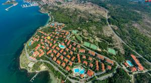 an aerial view of a resort on a hill next to the water at AJ Apartment 8, Santa Marina Holiday Village, Sozopol in Sozopol