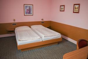 Postel nebo postele na pokoji v ubytování Hotel U Jiřího