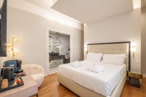 Katil atau katil-katil dalam bilik di Luxury Suites in the Heart of Cagliari