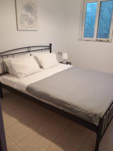Katil atau katil-katil dalam bilik di Nikitas apartment 2