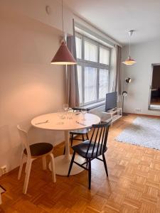 a dining room with a table and chairs at Nordic Sauna Experience in Helsinki