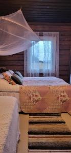 Postel nebo postele na pokoji v ubytování Villa Miilia maalaismajoitus ja spa