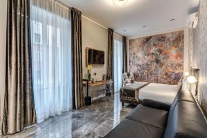 TV a/nebo společenská místnost v ubytování Apollo Boutique Hotel