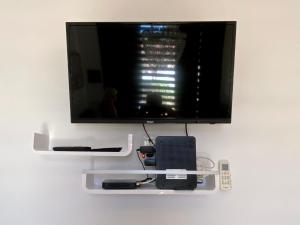 Televízia a/alebo spoločenská miestnosť v ubytovaní Pearl Apartment Pula