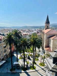 an aerial view of a city with palm trees at O Victoriano in Caldas de Reis