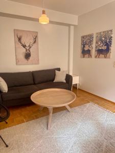 a living room with a couch and a table at Nordic Sauna Experience in Helsinki +10 photos