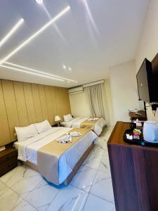 A bed or beds in a room at Inside Pyramids Hotel