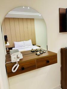 A bed or beds in a room at Inside Pyramids Hotel