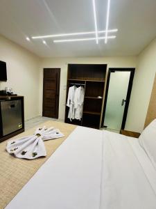 A bed or beds in a room at Inside Pyramids Hotel