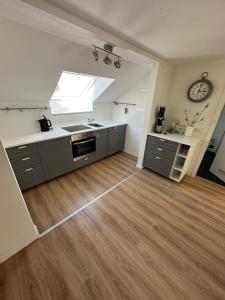 a kitchen with a sink and a counter top at Ferienwohnung Martin 2 Schlafzimmer in Neufahrn bei Freising +2 photos