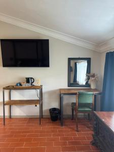 TV a/nebo společenská místnost v ubytování Casa M Tuscany