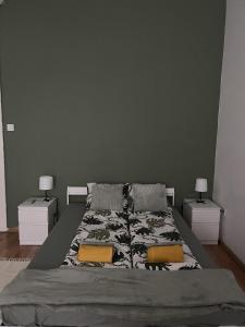 A bed or beds in a room at Palace district rooms