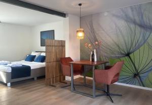 A bed or beds in a room at FACT Apartments