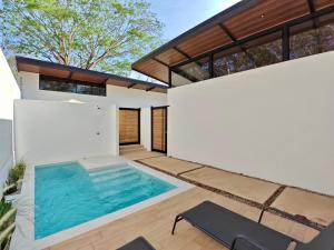 a swimming pool in the backyard of a house at Blissful Homes in Huacas