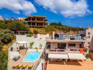 an aerial view of a house with a swimming pool at Lucia's Home in Stalos