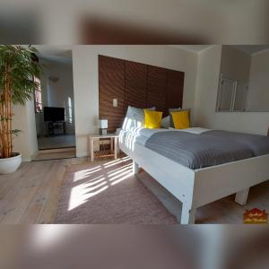 Postel nebo postele na pokoji v ubytování Hotelpension Pfarrhaus