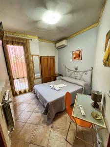 Postel nebo postele na pokoji v ubytování B&B Epos Acitrezza