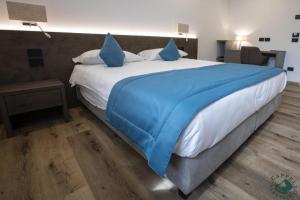 Giường trong phòng chung tại Albergo Cappello e Cadore