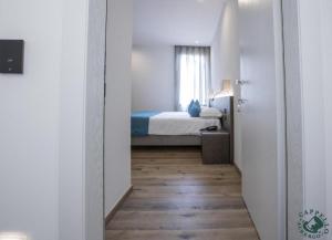 Giường trong phòng chung tại Albergo Cappello e Cadore