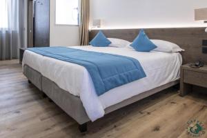 Giường trong phòng chung tại Albergo Cappello e Cadore