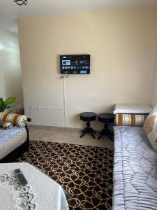 Ένα ή περισσότερα κρεβάτια σε δωμάτιο στο Residence afoulki 2 hay mohammadi